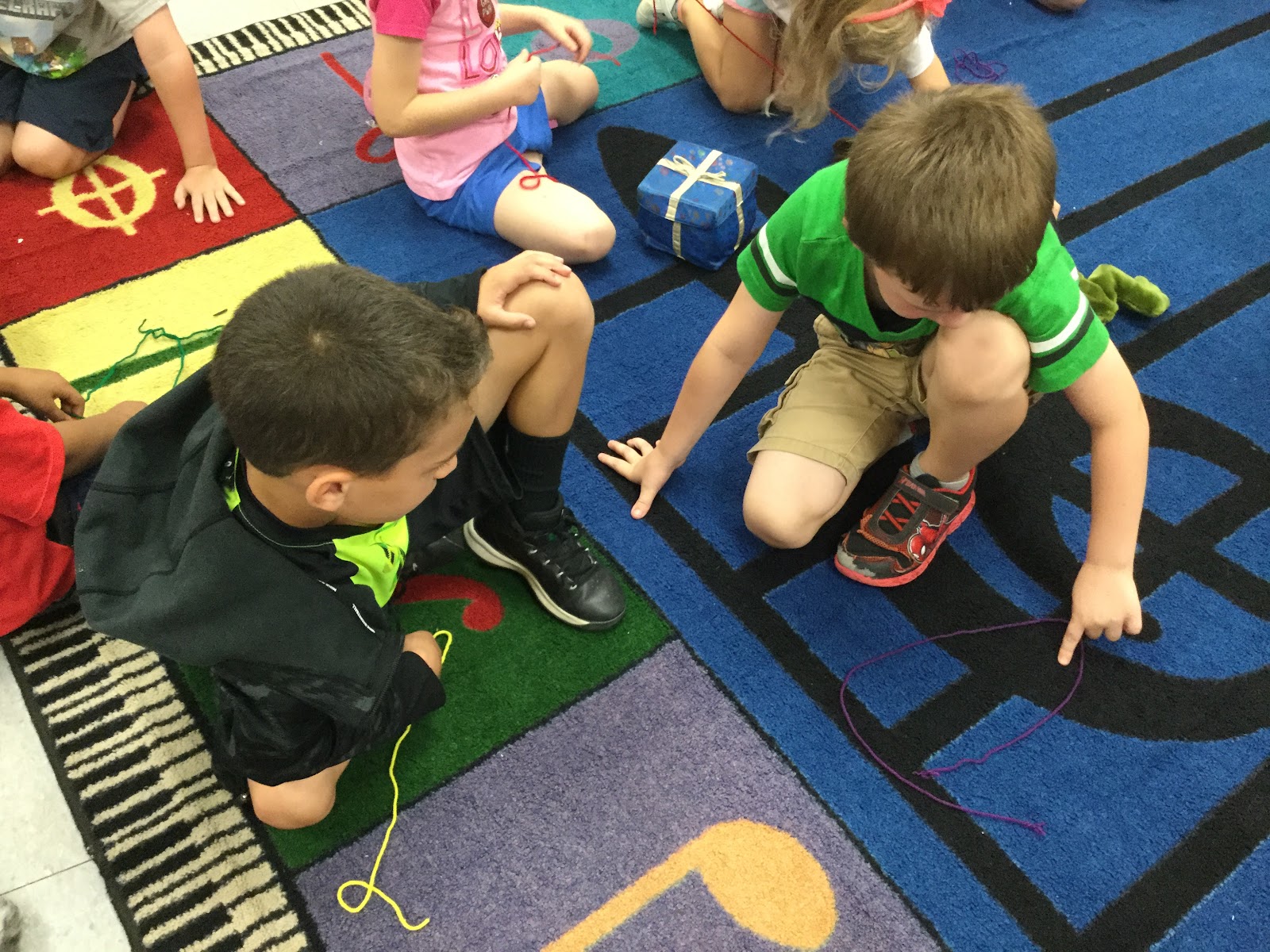 Students use yarn to help with vocal practice