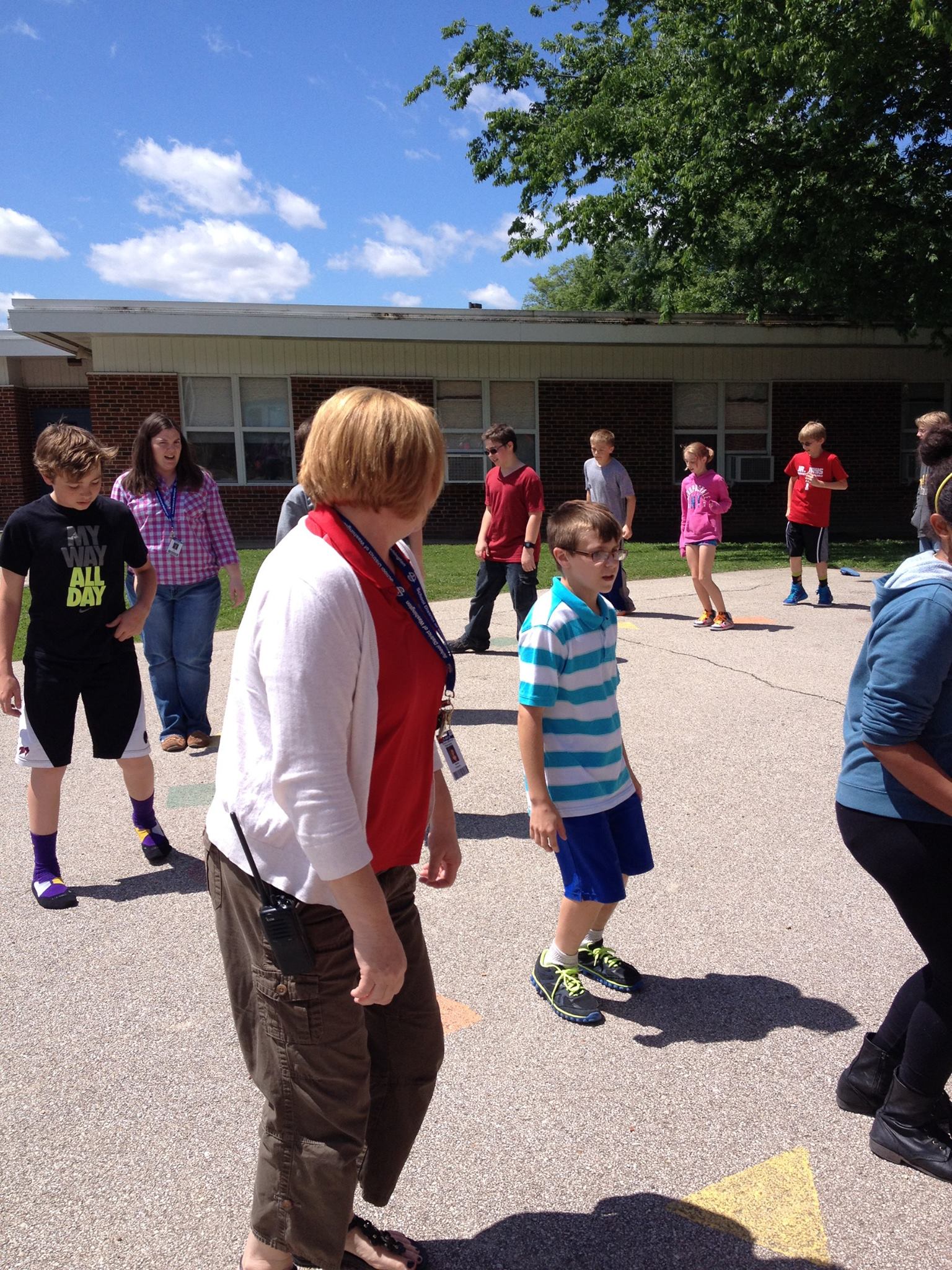 Assistant principal learns the dance "T'Smidje"